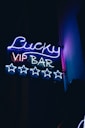 a neon sign that says lucky vip bar