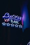 a neon sign that says lucky vip bar
