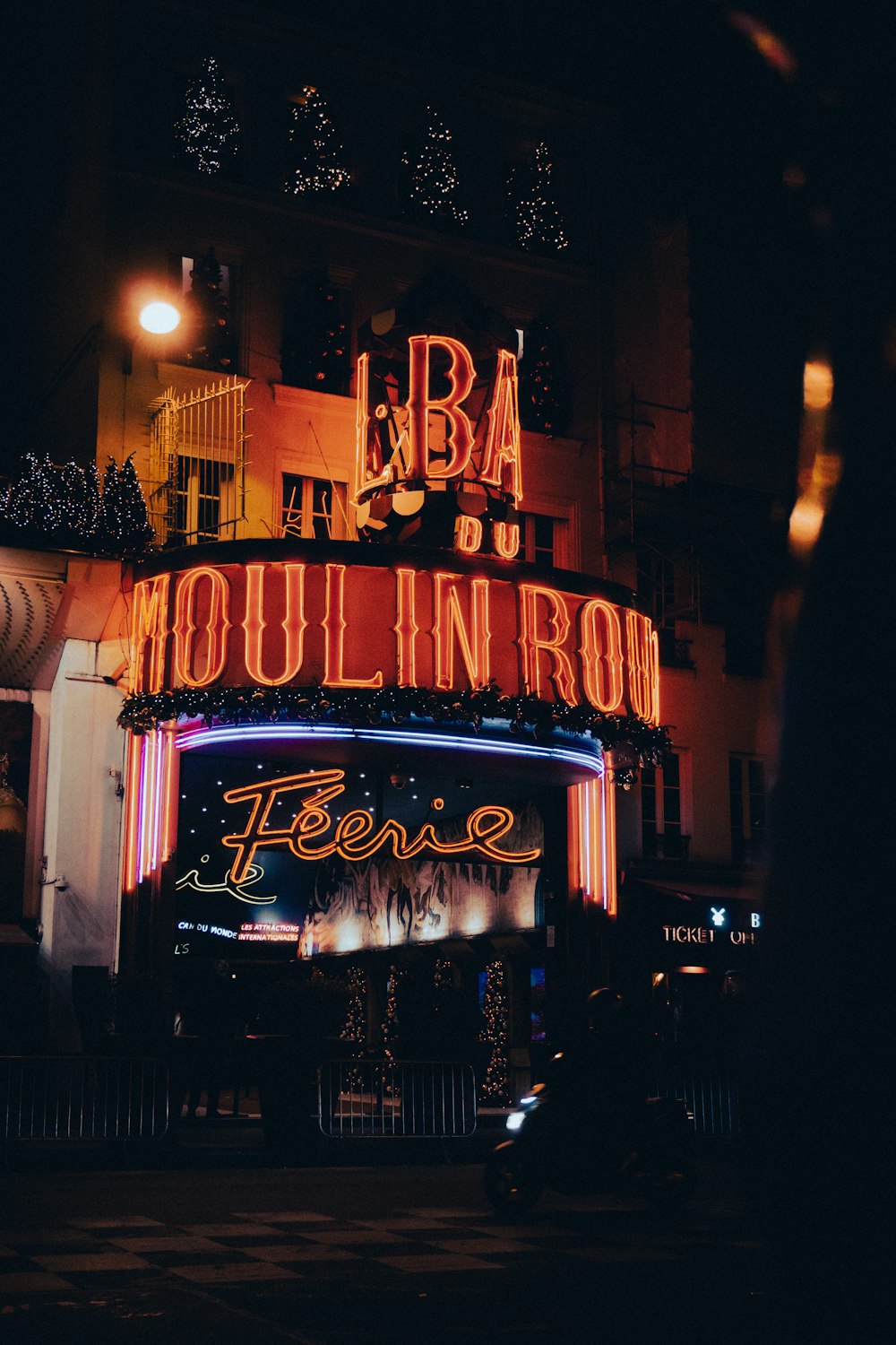 a neon sign on the side of a building