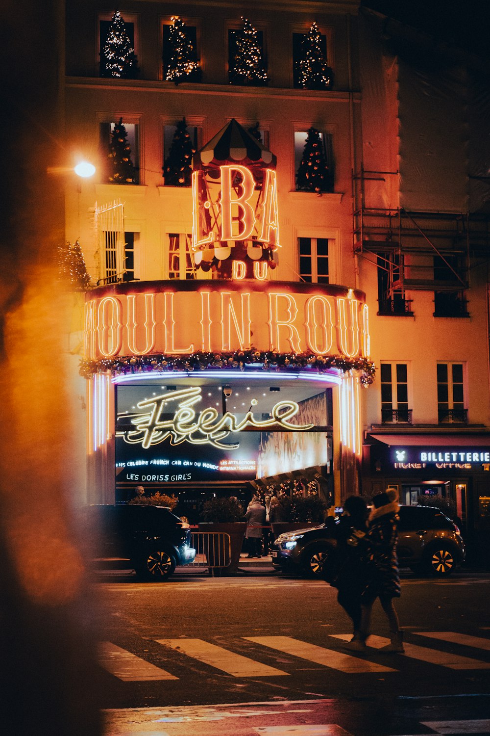 a building with a neon sign on the front of it