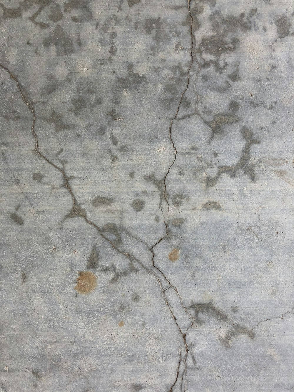 a close up of a wall with cracks in it