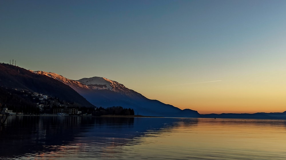 a lake with a mountain in the background