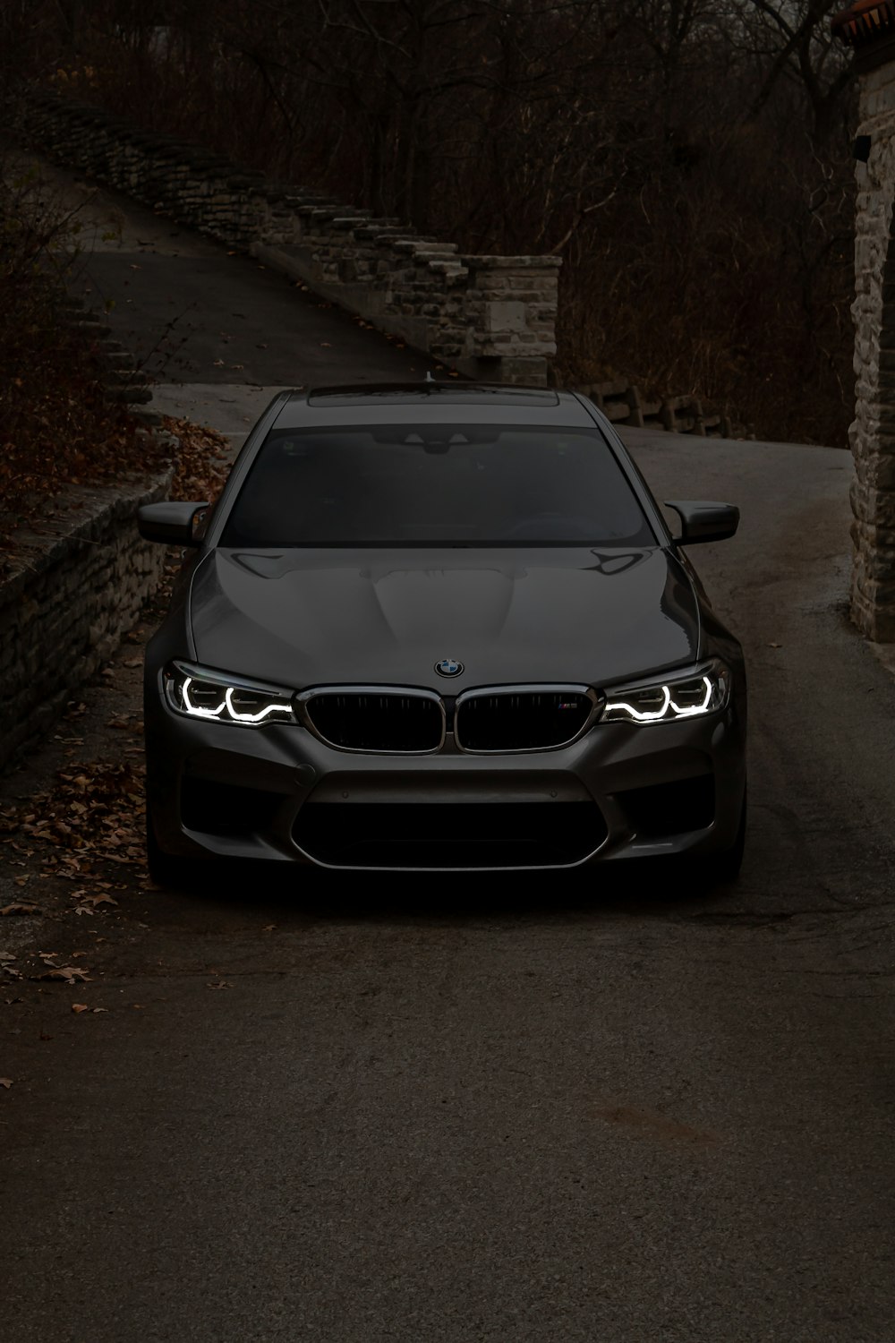 a black car parked on the side of a road