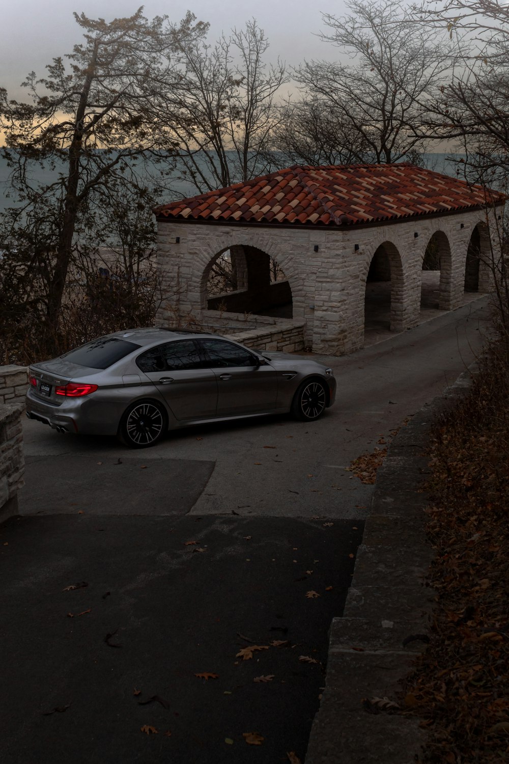 a car parked in front of a stone building