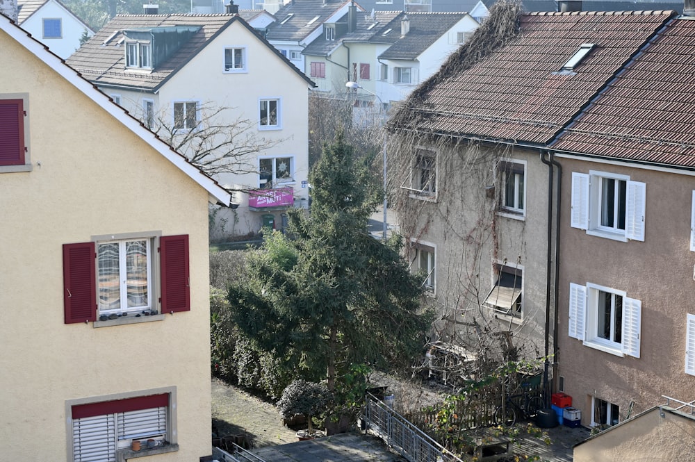 a view of some buildings and a tree