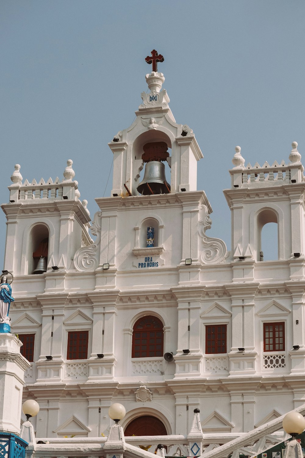 a large white building with a bell tower