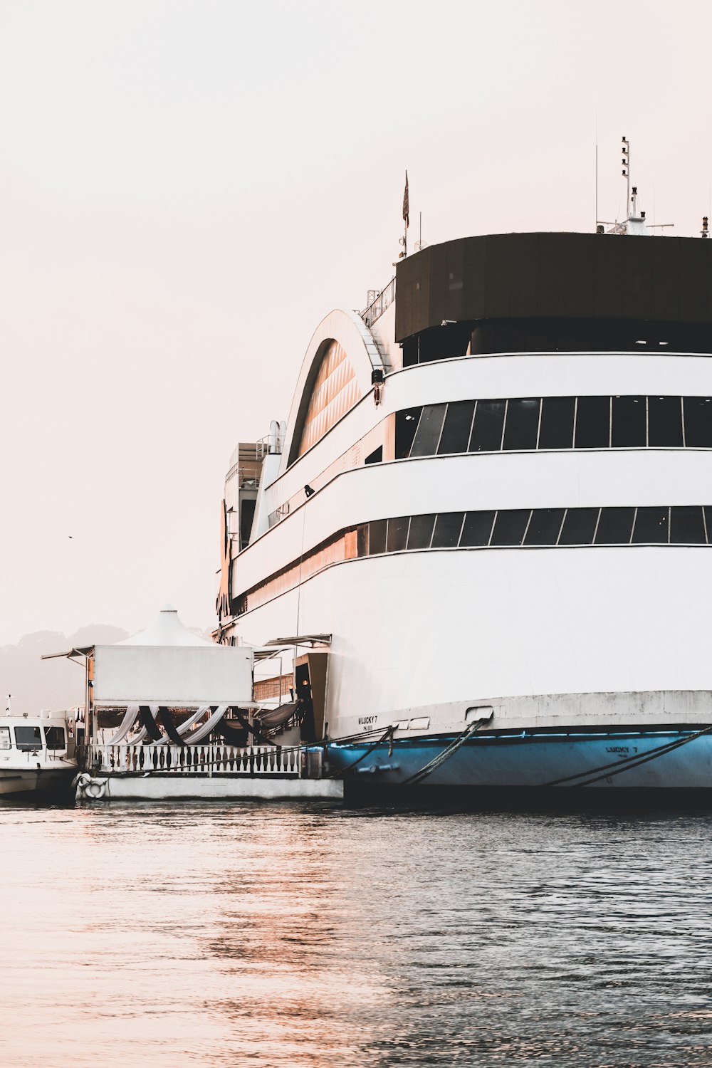 a large cruise ship docked in the water