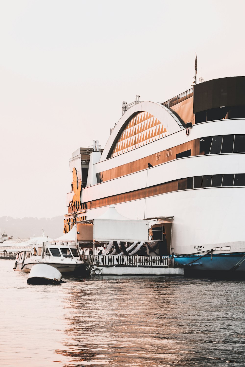 a large cruise ship docked at a pier