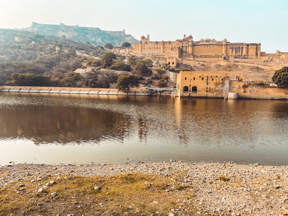 a large body of water with a castle in the background