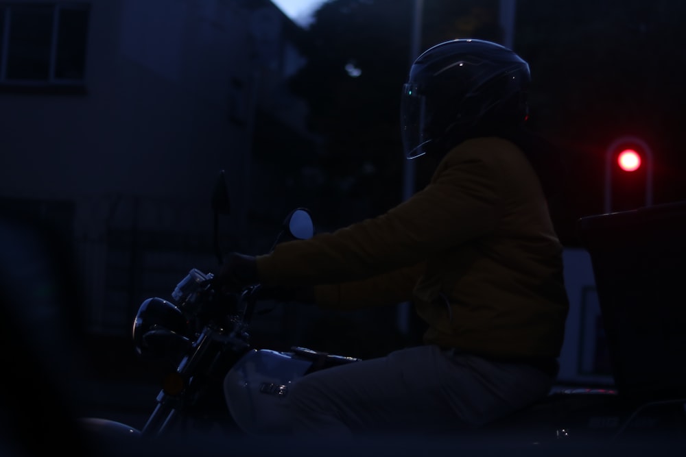 a person is riding a motorcycle at night