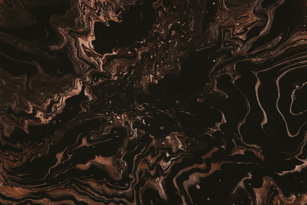 a close up of a black and brown marble