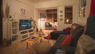 a living room filled with furniture and a flat screen tv