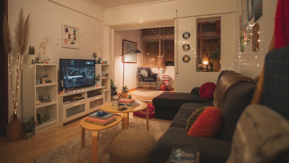 a living room filled with furniture and a flat screen tv