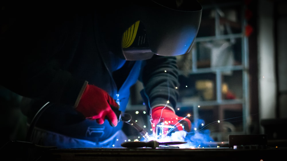 a welder working on a piece of metal