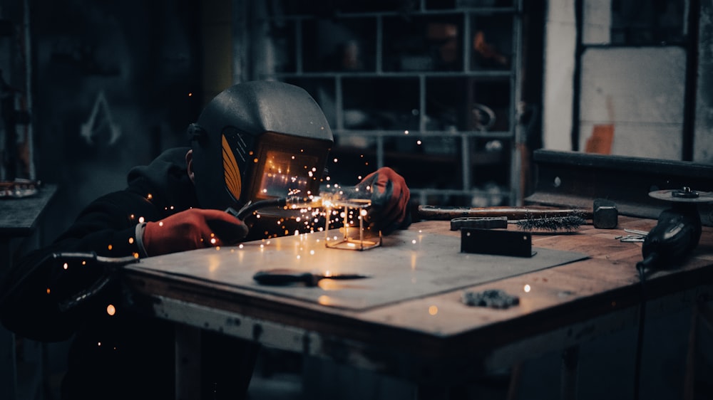 a welder working on a piece of metal