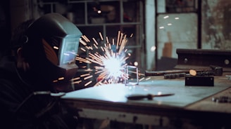 a welder working on a piece of metal