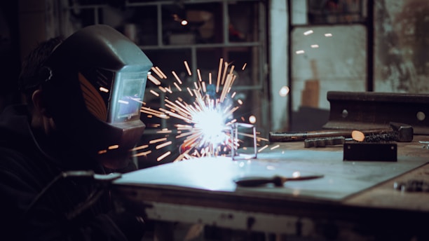 a welder working on a piece of metal