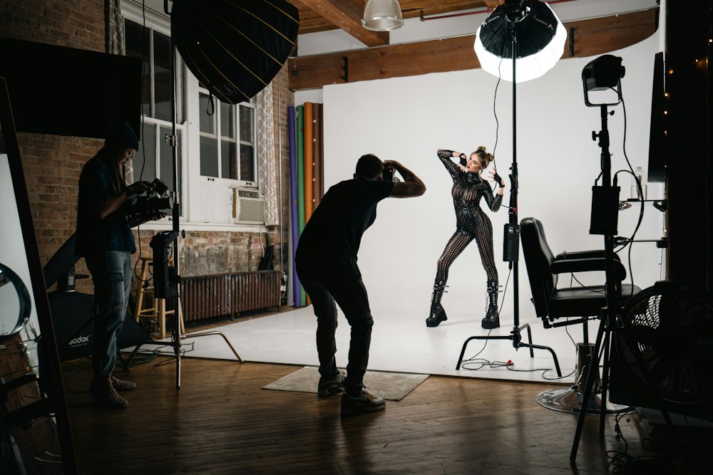 Photographer shooting a model in a lit studio, placeholder campaign shoot image