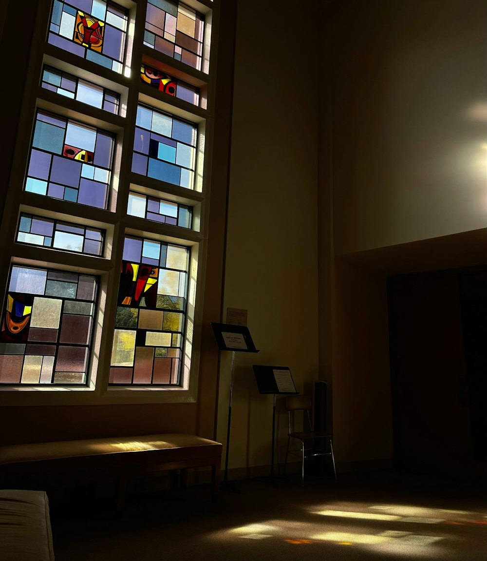 a large stained glass window in a church