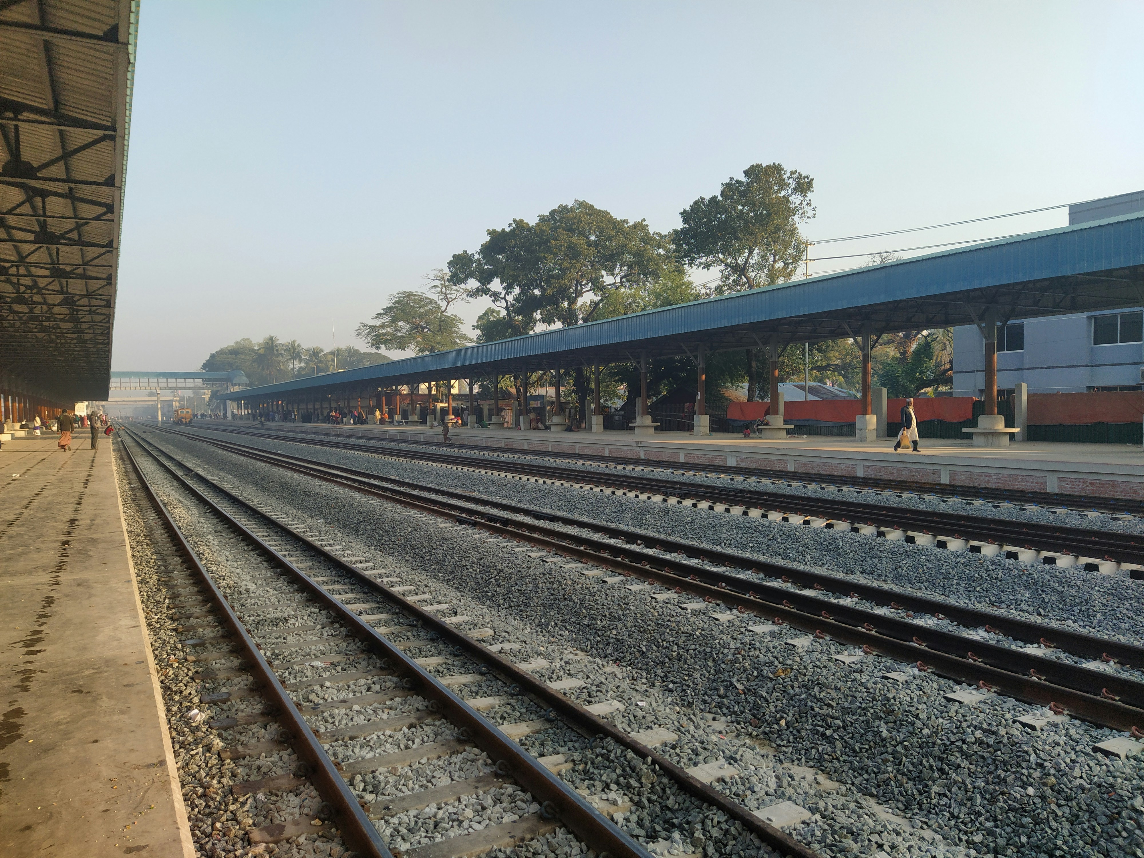 a train station with a train on the tracks