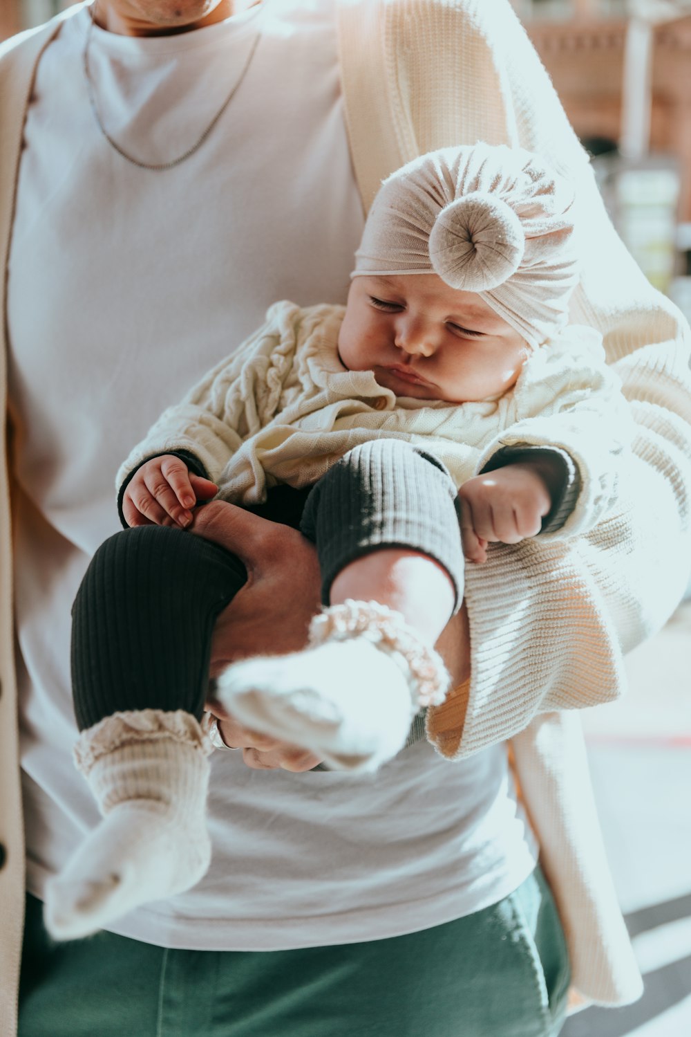 a man holding a baby in his arms