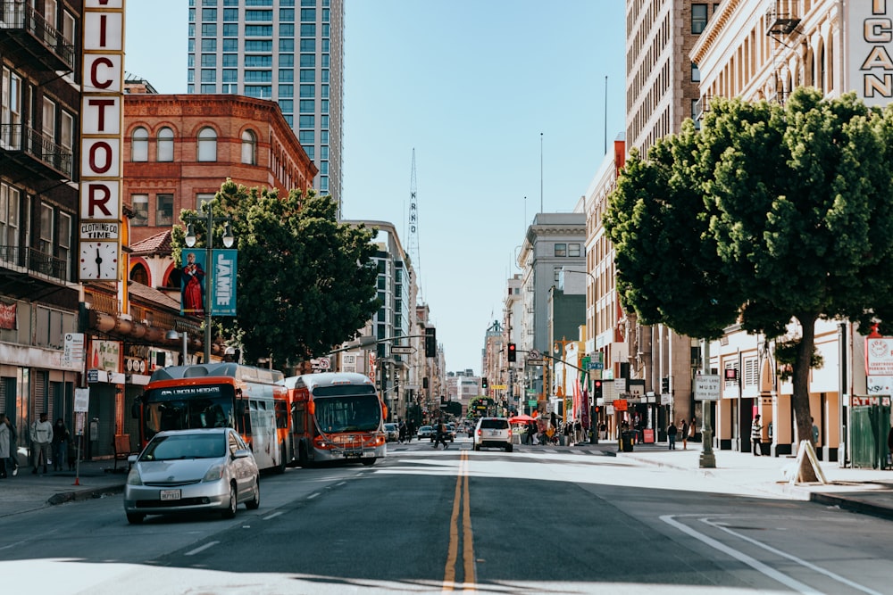 a city street filled with traffic and tall buildings