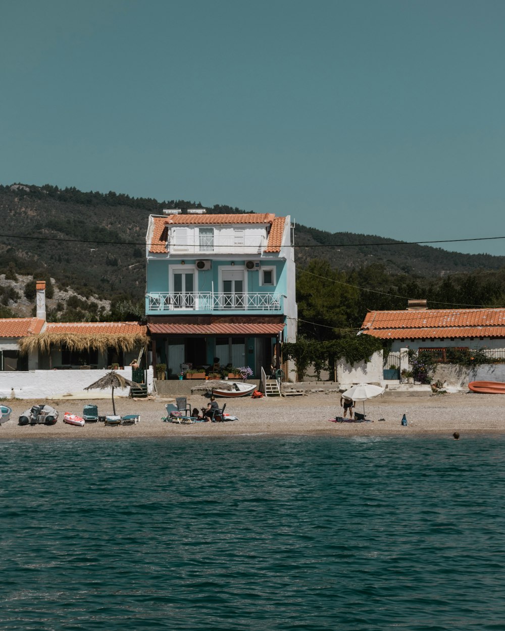 a house on the shore of a body of water