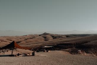 a tent set up in the middle of a desert