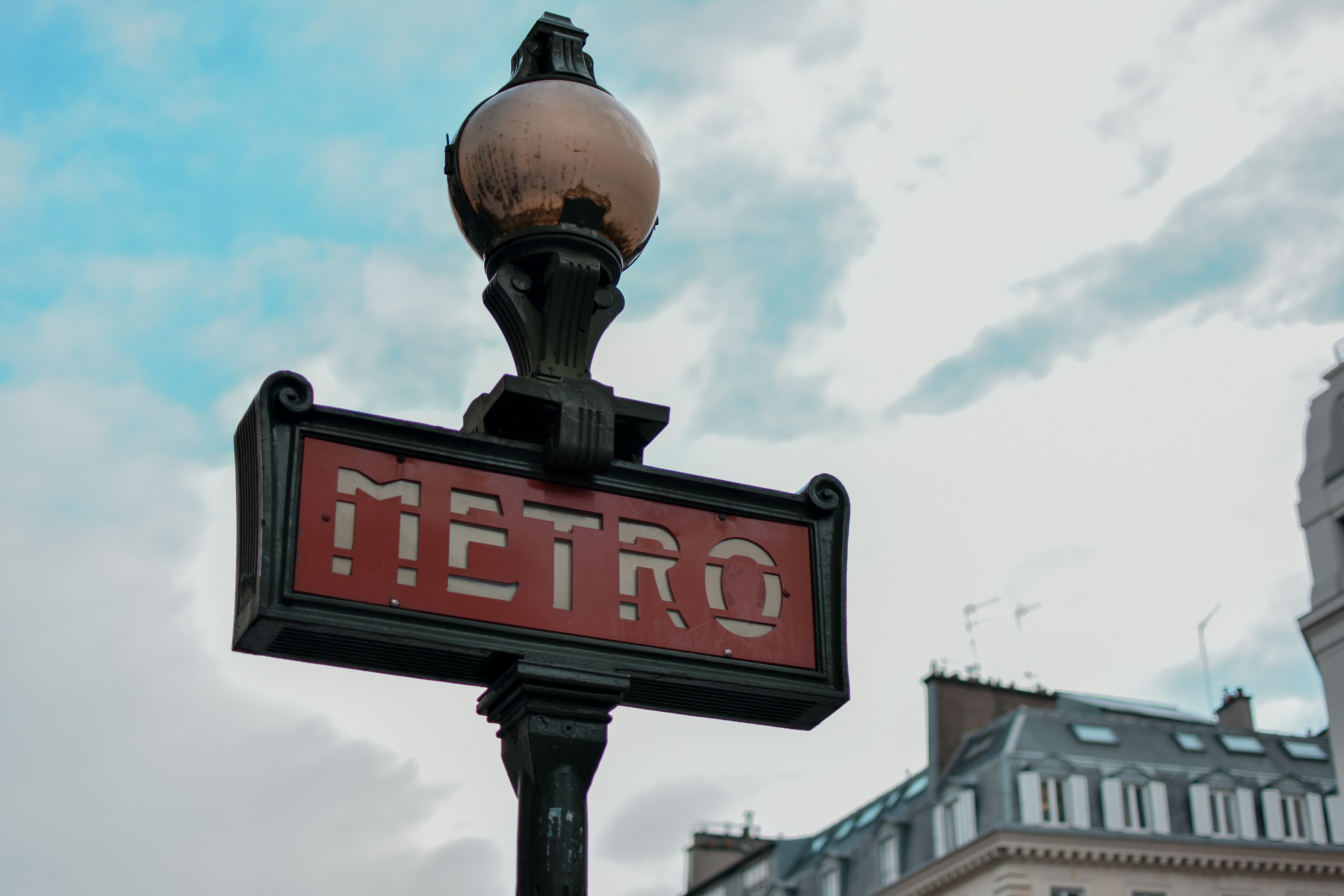 a street sign with a building in the background