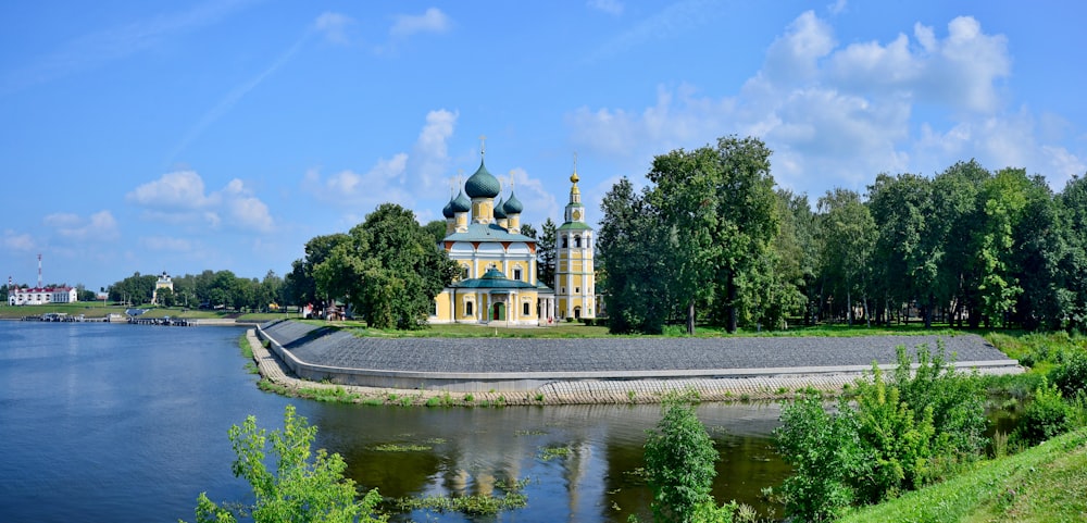 a large building sitting on top of a lush green hillside