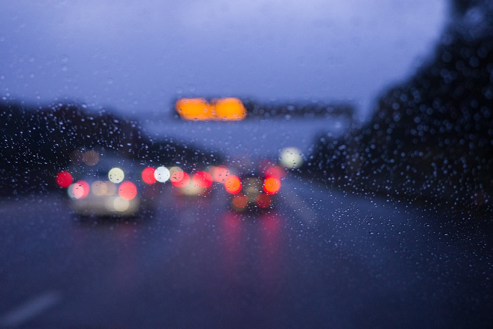 a blurry picture of cars on a rainy day