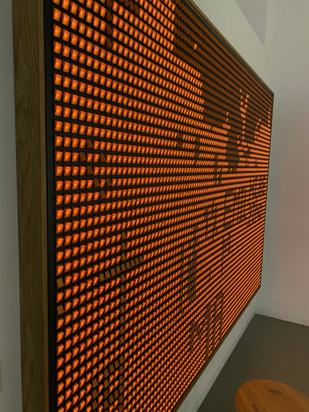 a wall with a large orange screen on it
