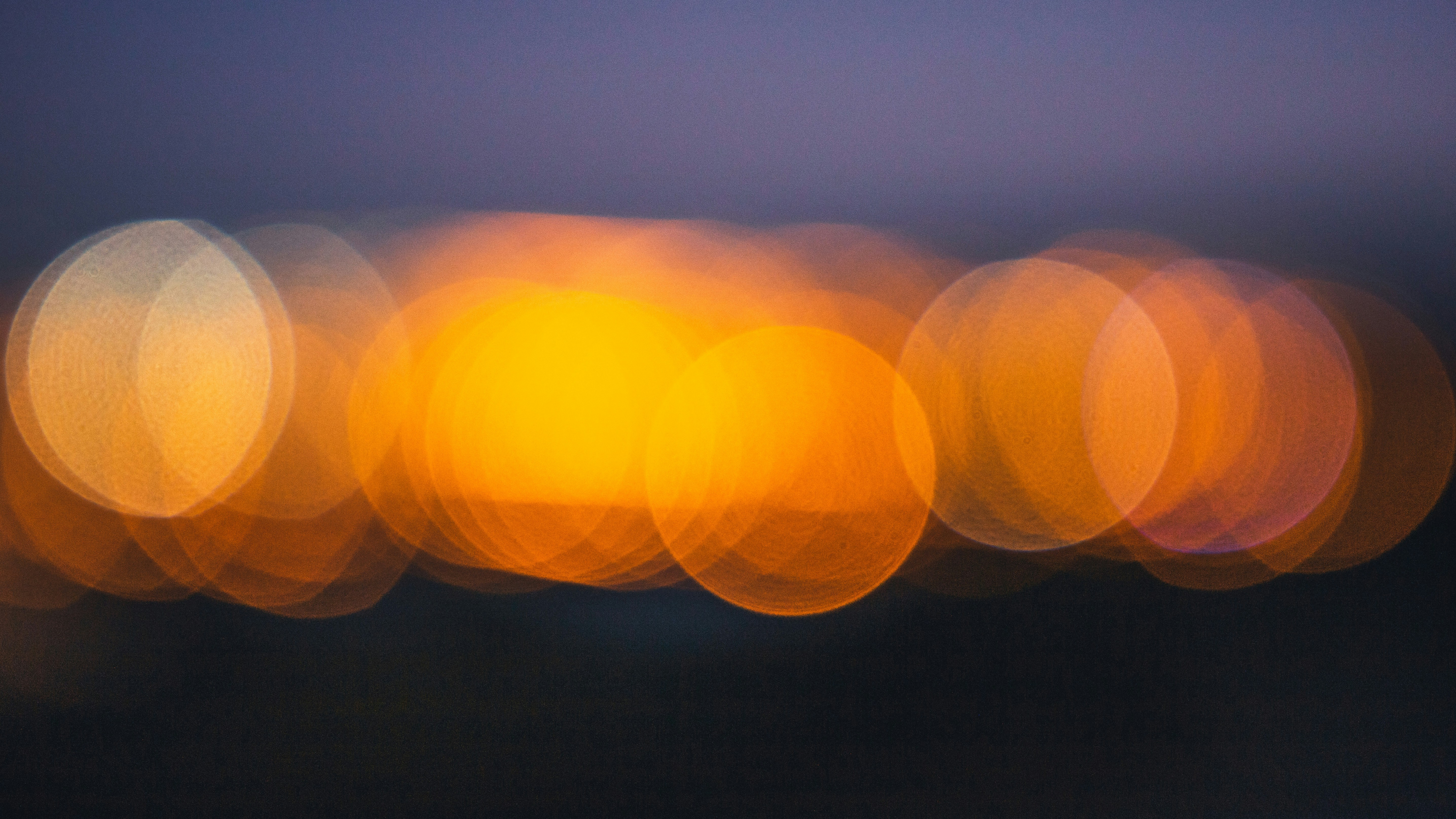 a blurry photo of a city street at night