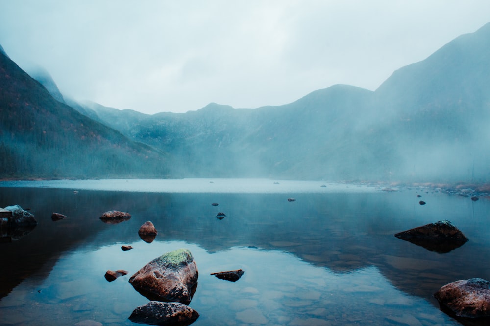 a body of water surrounded by mountains and rocks