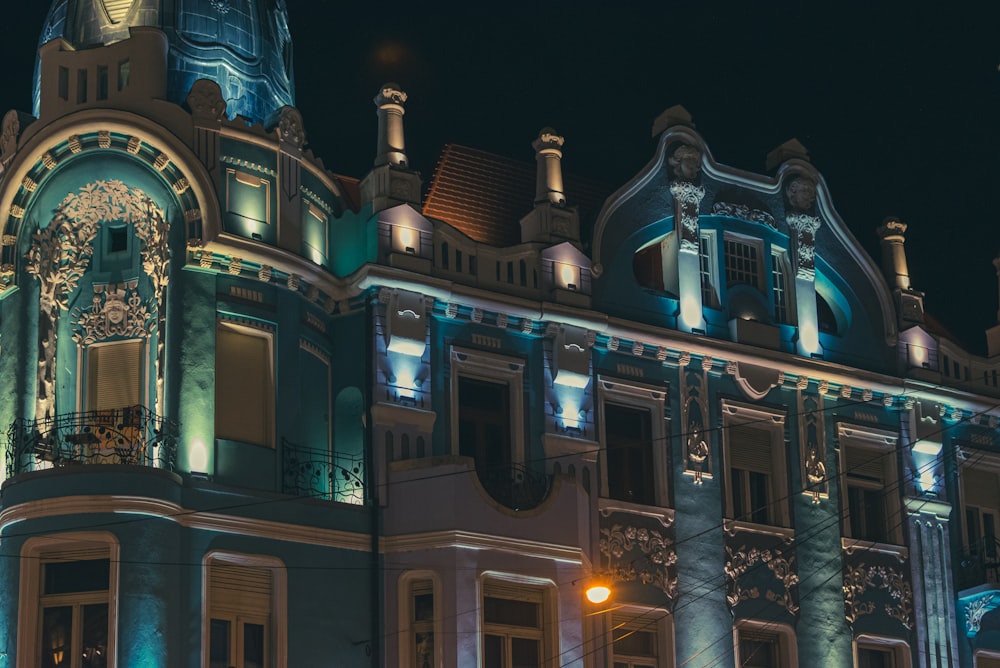 a building lit up with blue lights at night