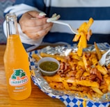 a person sitting at a table with a plate of food