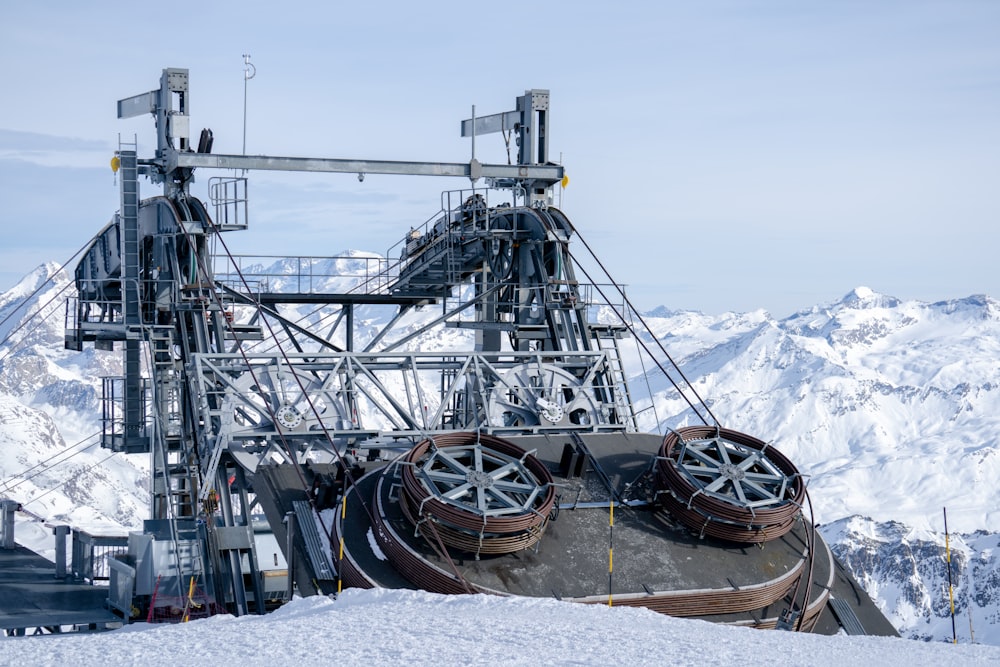 a ski slope with a snow covered mountain in the background