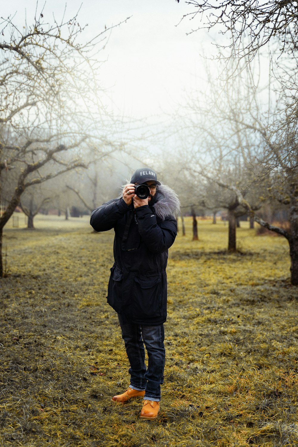 a man is taking a picture of himself in the park