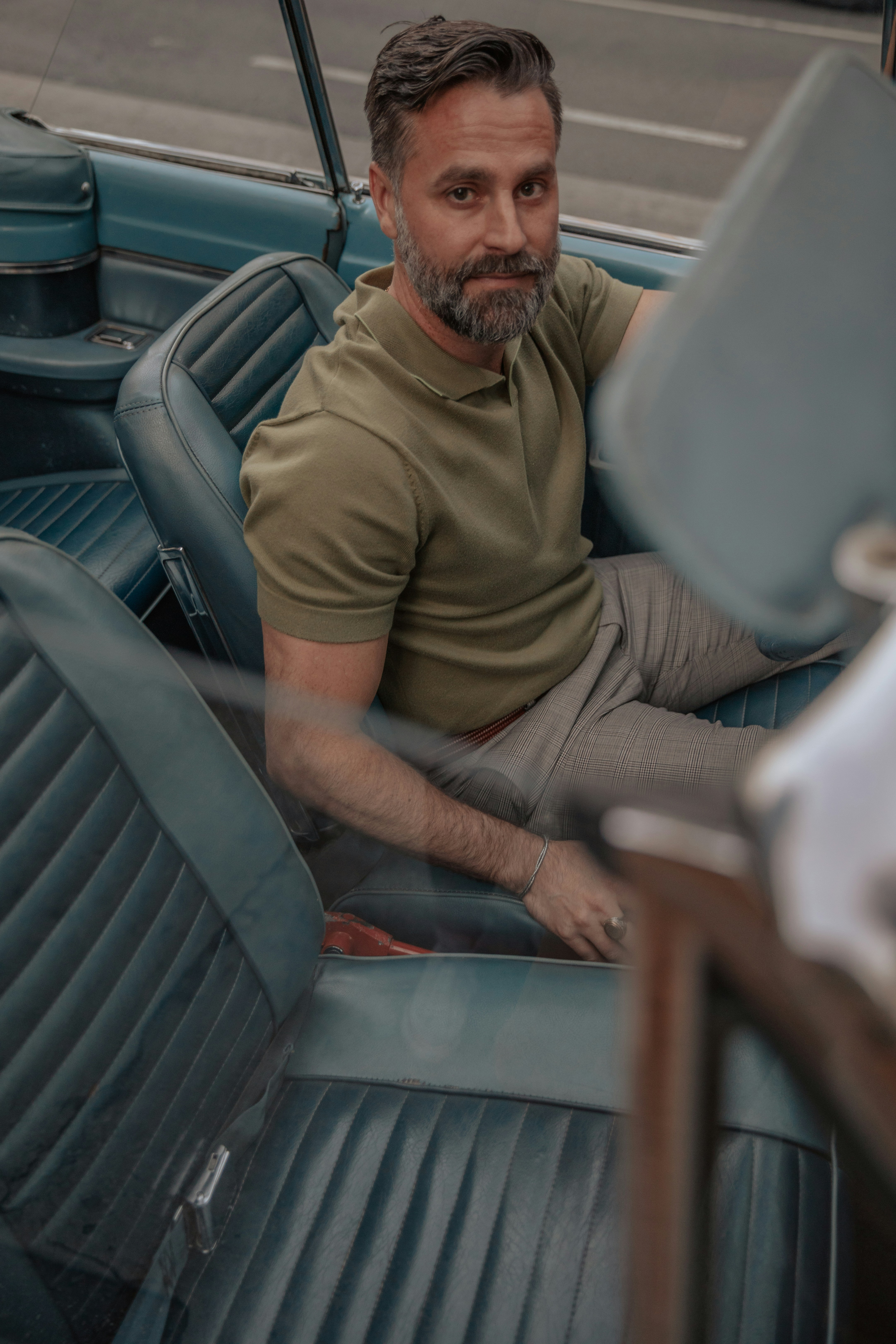 Passenger riding in the back seat of a car