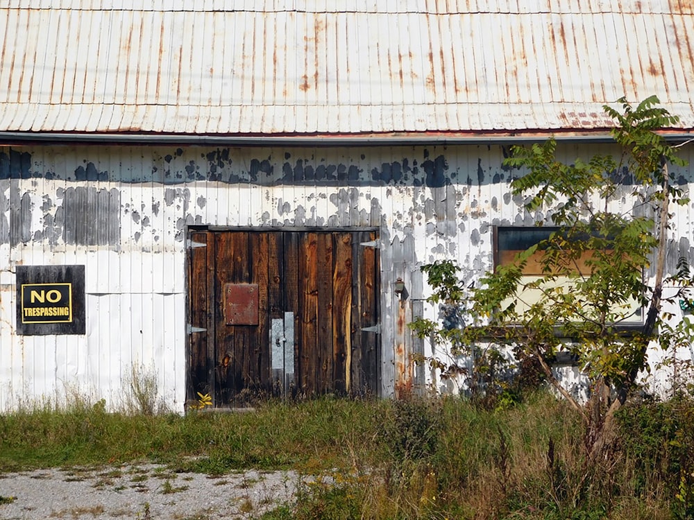 an old building with a no parking sign on it