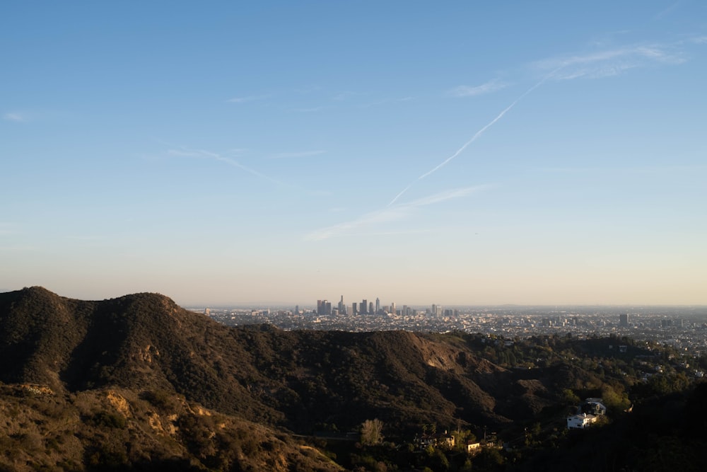 a view of a city from the top of a hill