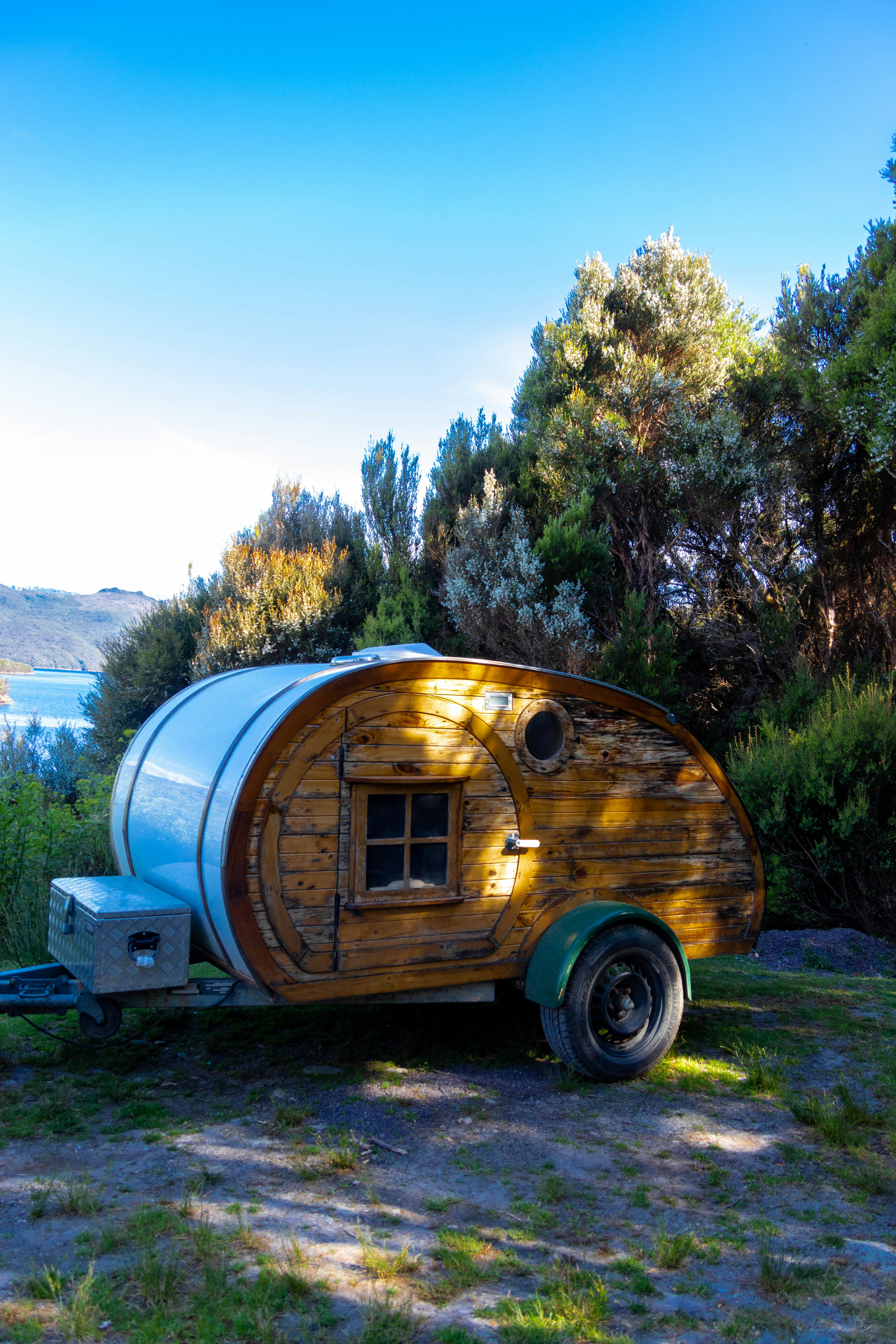 a small trailer with a barrel like structure on the back of it