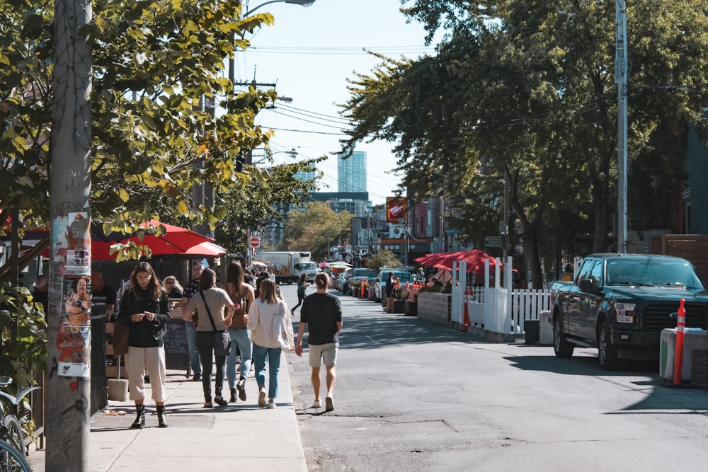 a group of people walking down a street