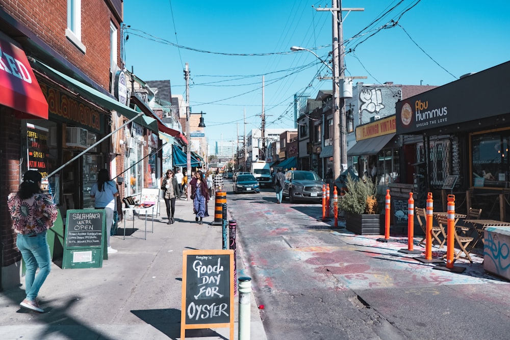 a city street with people walking on the sidewalk