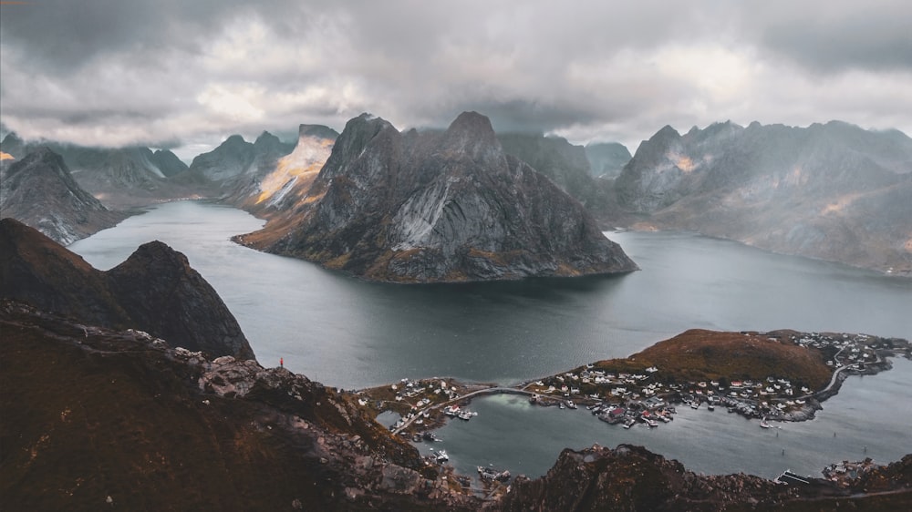 an aerial view of mountains and a body of water