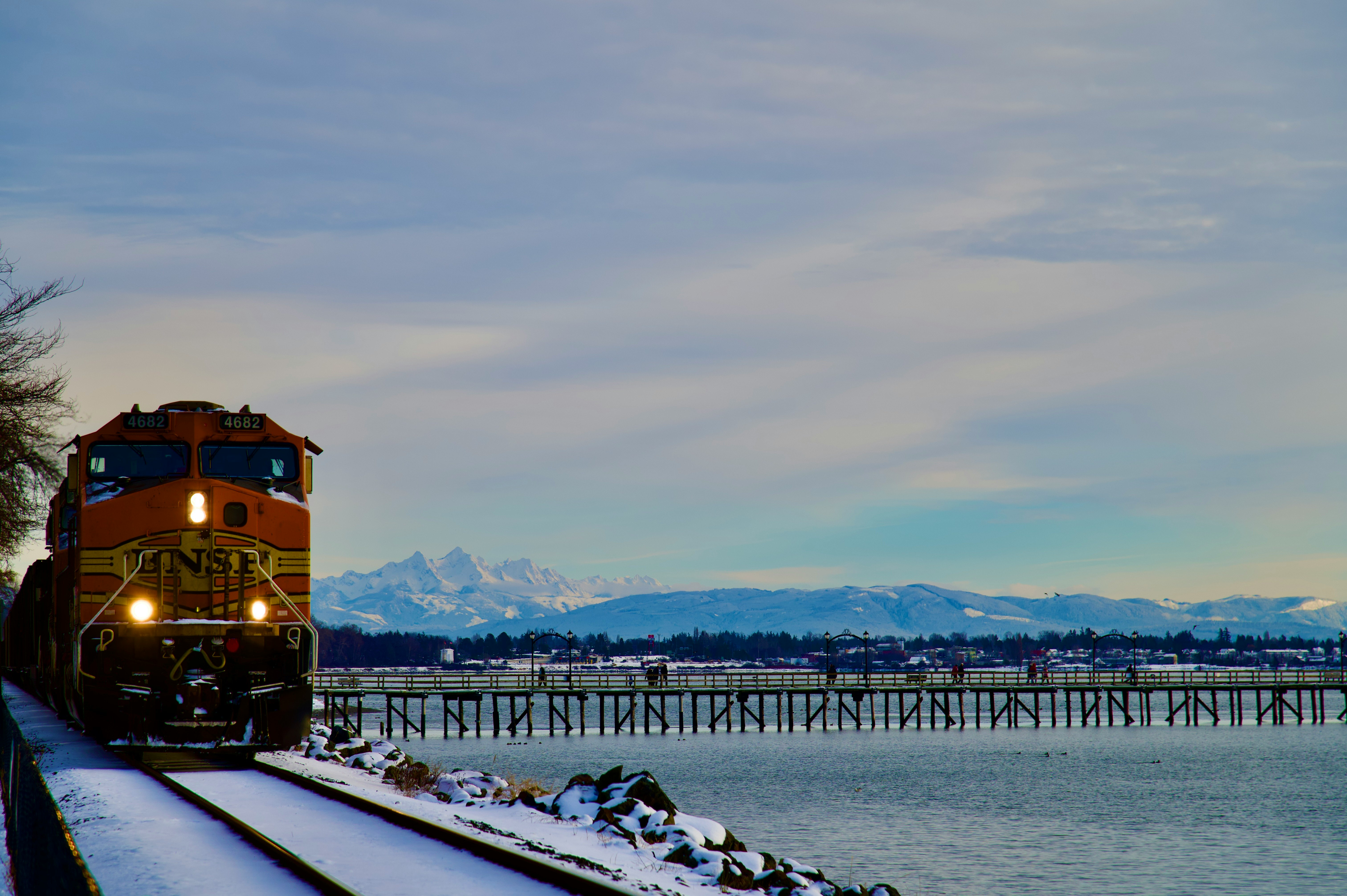 A train passing by White Rock, BC, Canada's longest pier.