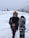 A happy customer skiing in the snow.