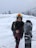 A happy customer skiing in the snow.