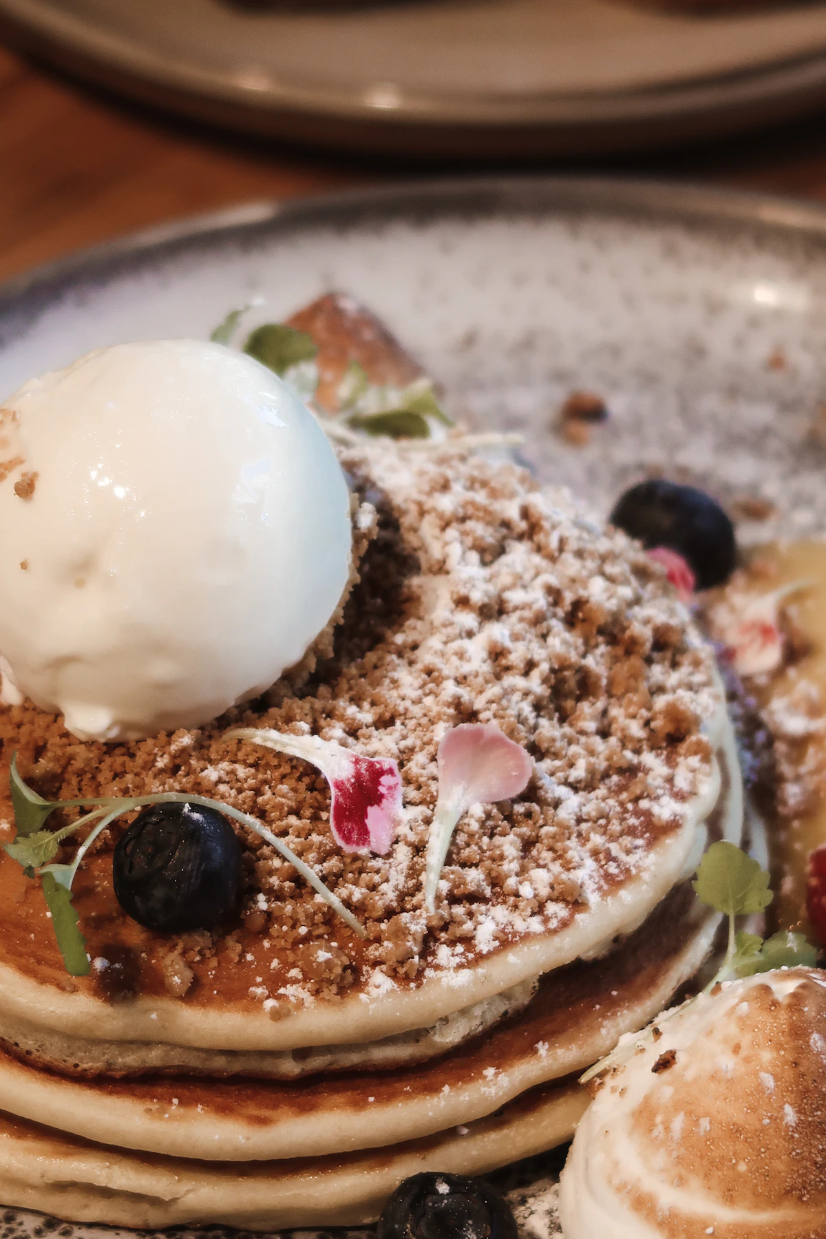 A stack of pancakes topped with fruit and ice cream (representative image)