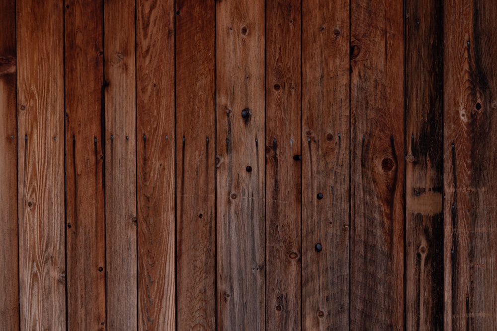 a wooden wall that has a clock on it